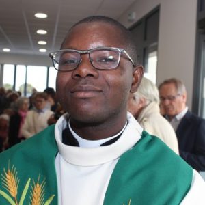 Père Damien Ayola